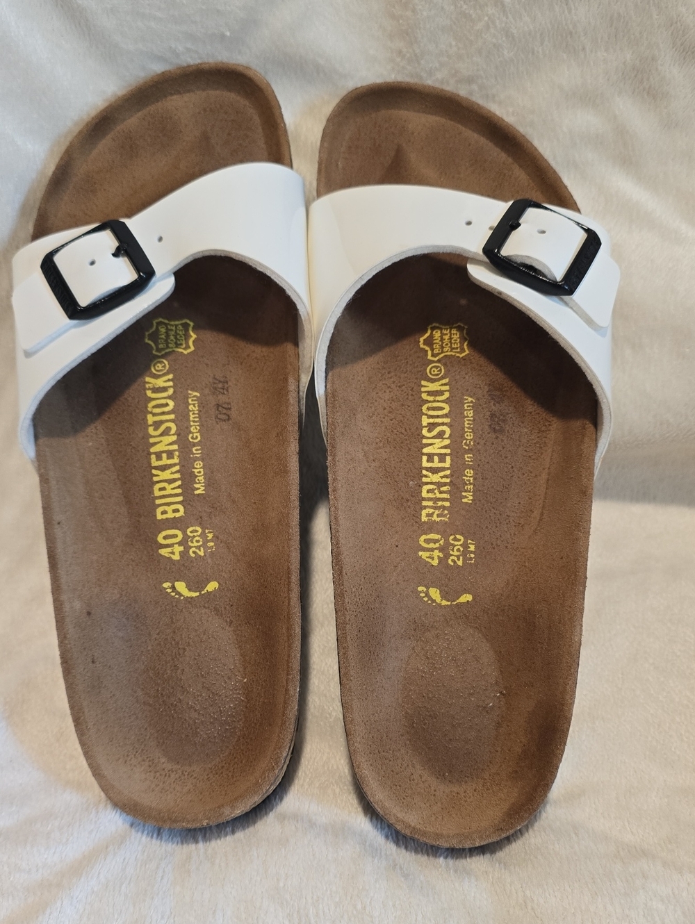 Birkenstock White Single Strap Slide Sandals with Black Buckles. 40, US 9-9.5 .